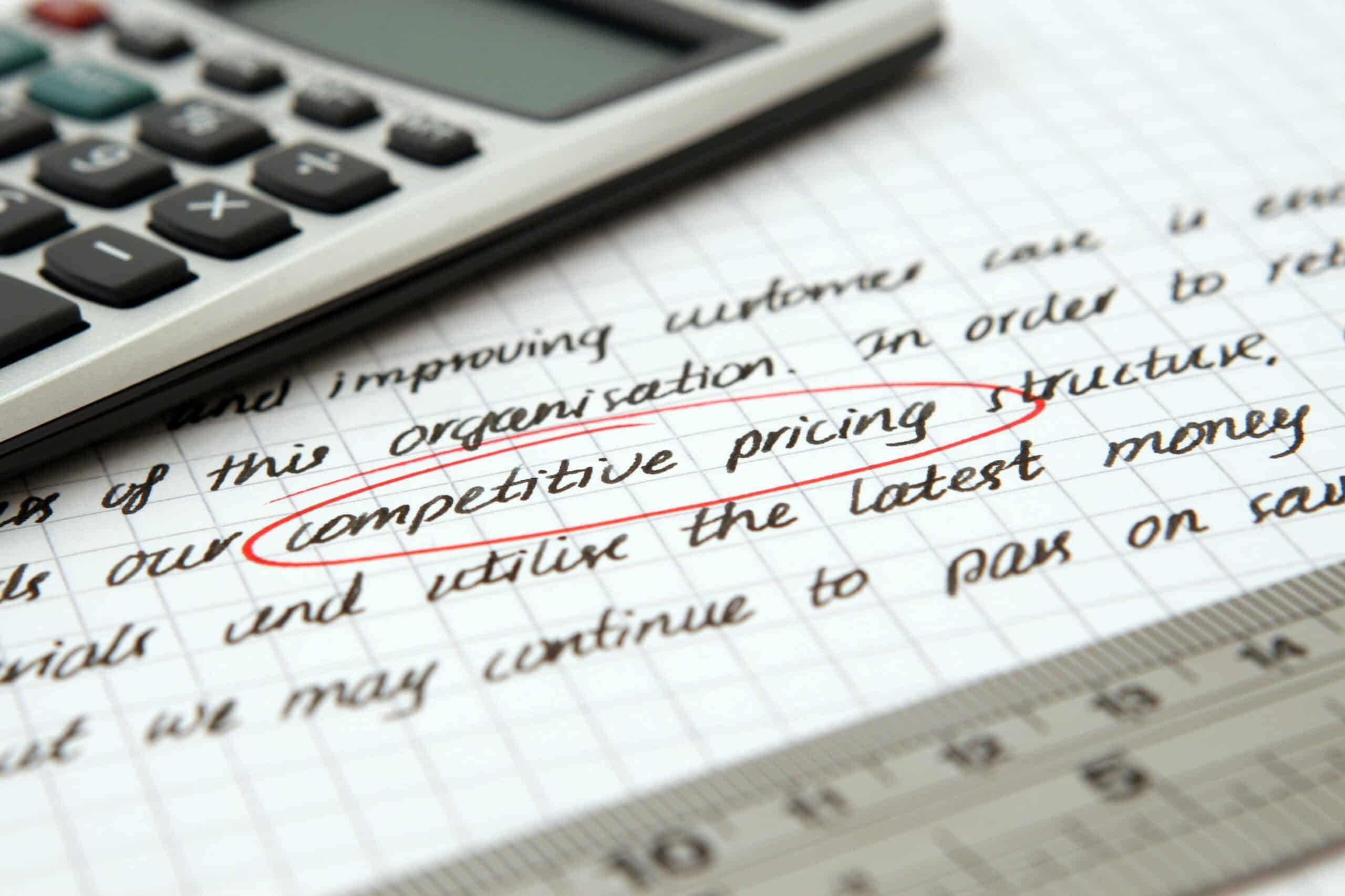 Competitive pricing is an important strategy for setting freelance rates. Photo by Pixabay: https://www.pexels.com/photo/competitive-pricing-handwritten-text-encircled-on-paper-262470/